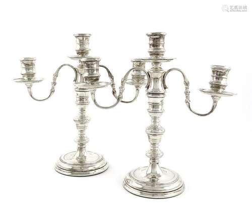 A pair of modern silver three light candelabra, by…