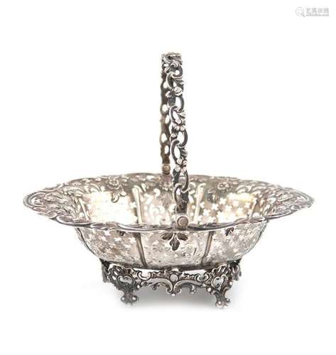 A George III silver swing handled basket, by Willi…