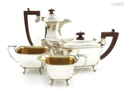 A matched four piece silver tea set, by J. Gloster…