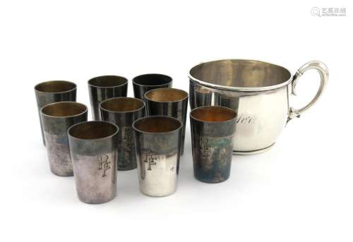 A set of nine German silver tot cups, tapering cir…