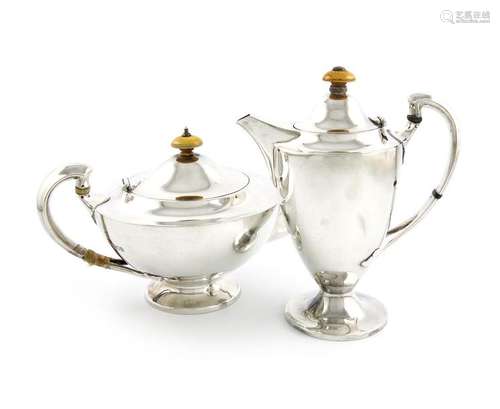 Λ A silver teapot and hot water pot, by the Barnar…