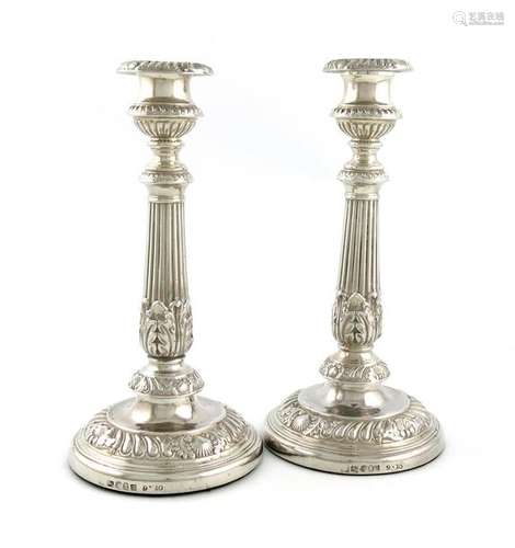 A pair of George IV silver candlesticks, by Smith,…