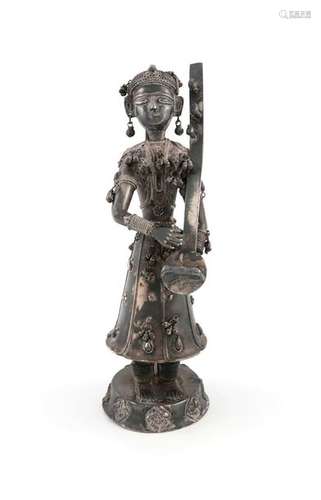 A south east Asian silver figure of a lady, with a…