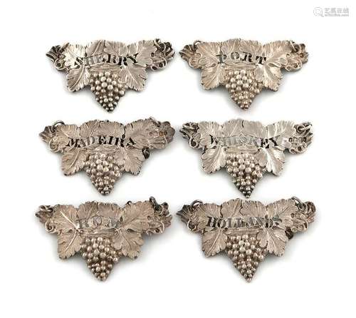 A set of six Victorian cast silver wine labels, by…