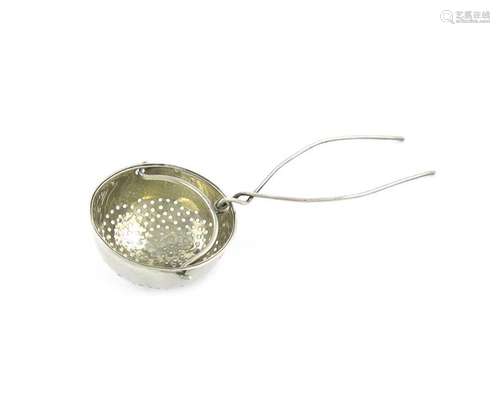 A George III silver tea strainer, by Phipps and Ro…