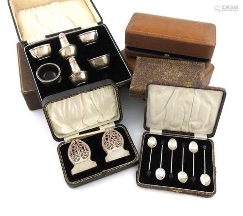 A collection of seven cased silver sets, comprisin…