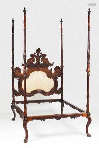 An important D. José canopy bedRosewoodRichely decorated headboard with carved floral motifs and