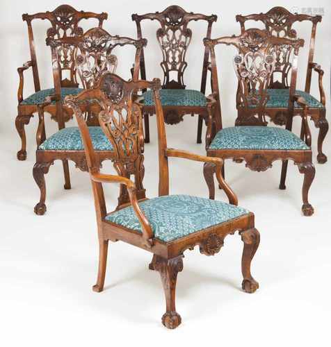 A set of twelve D. João V armchairsPierced and scalloped back splats decorated with carved