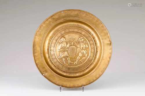 A Nuremberg alms dishYellow metalRaised decoration with 