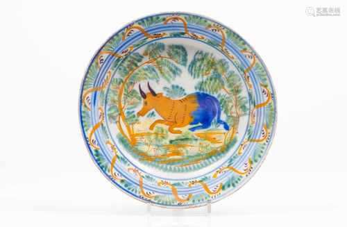 A plateFaiencePolychrome decoration of landscape with cattlePortugal, 19th centuryDiam.: 34 cm