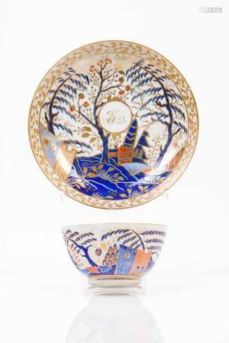 A cup and saucerChinese export porcelainRich polychrome decoration in shades of blue, salmon and