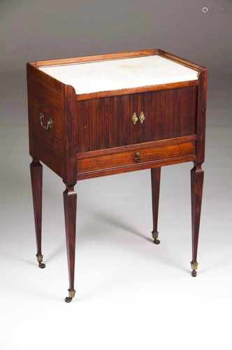 A Louis XVI bedside cabinetMahoganyMarble topRoll top foorsYellow metal hardware and