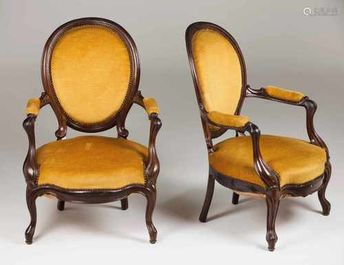 A pair of fauteuilsRosewoodCarved decorationYellow velvet covered backs, seats and armrestsPortugal,