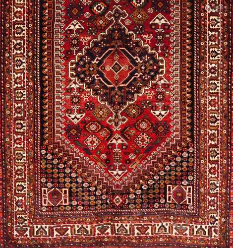 A Shiraz rug, IranWool and cotton of geometric pattern in bordeaux, salmon and blue shades250x165