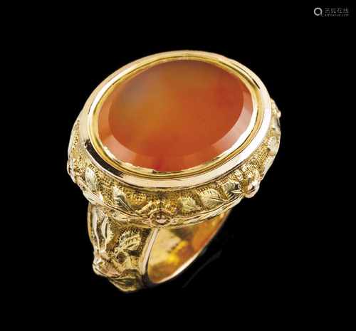 A baroque ringGoldFoliage scroll raised and chiselled motifs set with oval orange coloured agate18th