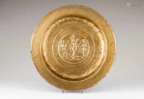 A large Nuremberg alms dishYellow metalRaised decoration with 