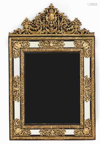 A large wall mirrorWooden frameGilt metal raised foliage scroll decorationScalloped crestEurope,