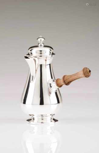 A chocolate potPortuguese silverPlain with turned wooden handleLisbon hallmark, Eagle (916/000)