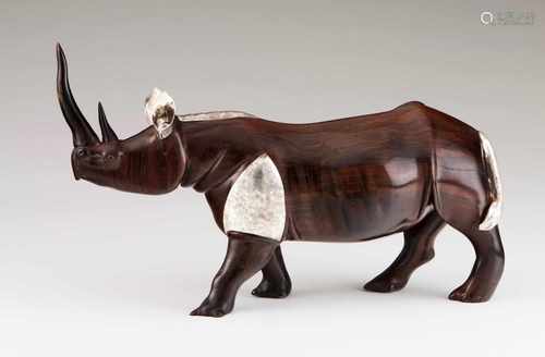 A rhinocerosPortuguese silver and African timber bodyRhinoceros sculpture with chiselled silver