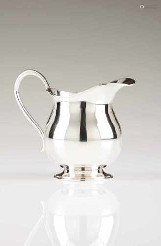 A milk jugSilverPlain with volute handleOporto hallmark, Eagle (916/000) for 1938 - 1985 and same