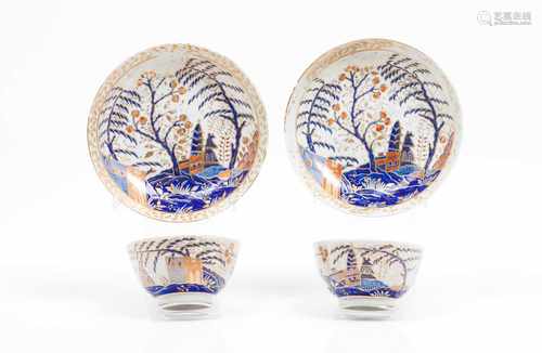 A cup and saucerChinese export porcelainBlue, pink, salmon and gilt decoration with buildings, trees