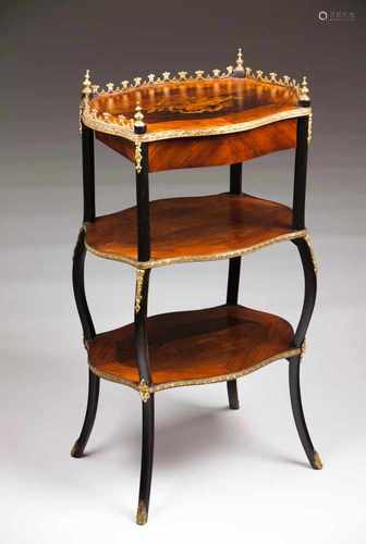 A Napoleon III gueridonRosewood with marquetry decorationGilt metal decorative elementsTwo shelves