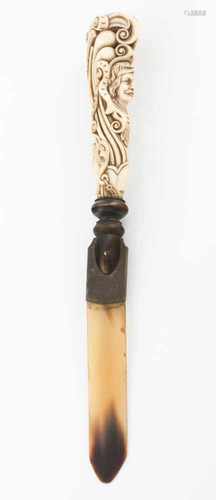 A paper knifeCarved ivory handleRepresenting busts of lady and gentleman and floral motifs and