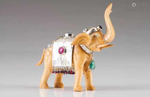 A Luiz Ferreira elephantSilver and boneA raised trunk elephant sculpture ornamented in chiselled