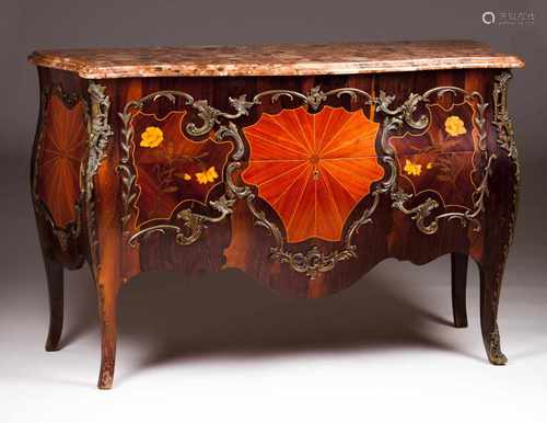 A Louis XV commodeMarquetry decoration depicting floral motifsTwo long drawersBronze mounts and