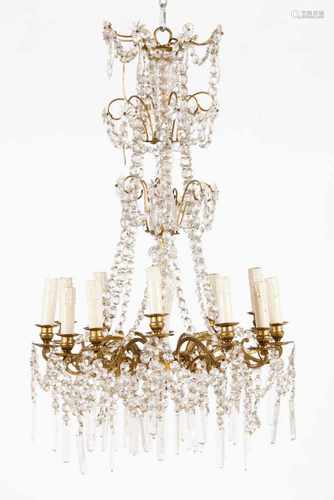 A Napoleon III twelve branch chandelierYellow metal structureGlass and cut crystal pendantsFrance,