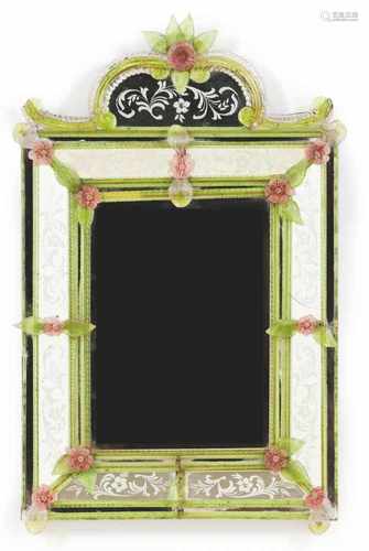 A Venetian wall mirrorEngraved decoration depicting floral motifs and molded glass mountsItaly, late