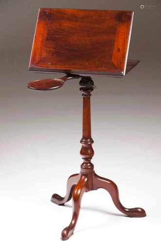 A George III tripod reading tableMahoganyRectangular tilt topA circular candlestand holderTurned