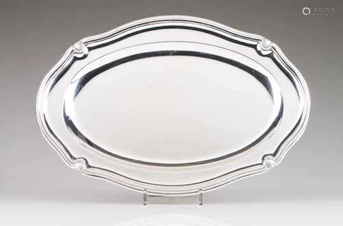 An oval platterEuropean silverPlain centre and scalloped lip with relief shell decorationBelgian