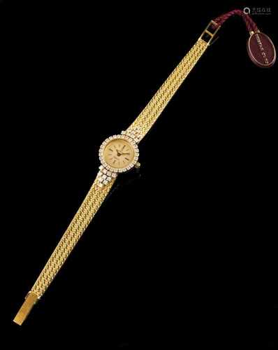 A Omega watchGold case and strapLadies model, set with brilliant cut diamonds totaling (ca.1.30ct)