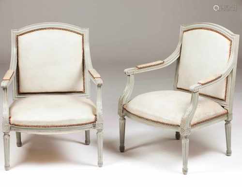 A pair of fauteuilsPainted woodCovered in faux leather with metal tacks