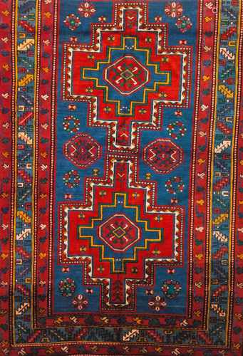 A Shirvan rug, RussiaWool and cotton of geometric pattern in blue, bordeau and salmon