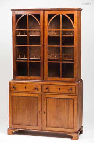 A D.Maria cupboardMahoganyUpper section with glazed doors and shelvesLower section with two