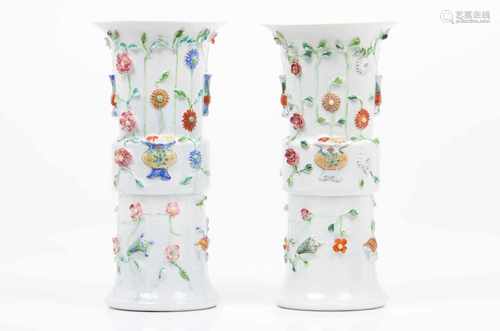 A pair of cylinder vasesEuropean porcelainFollowing chinese porcelain prototypesRaised polychrome