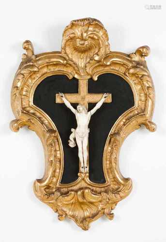 A crucified ChristIvory sculptureIn carved and gilt wooden frameFrance, 19th century(minor defects)