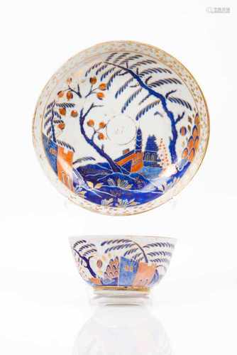 A cup and saucerChinese export porcelainRich polychrome decoration in shades of blue, salmon and