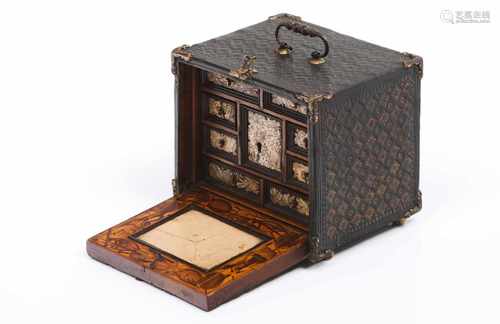 A collectors miniature cabinetEngraved and gilt leather coated wood, gilt metal harware and ivory