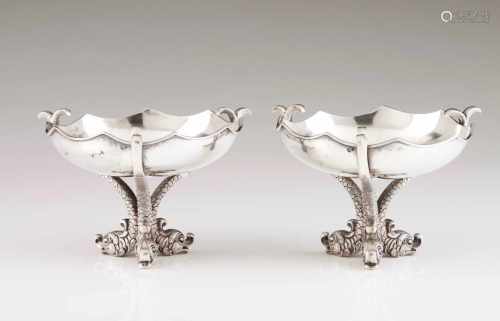A pair of Empire style bowlsPortuguese silverPlain, scalloped lip body on a three stylised dolphin