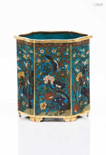 A brush potIn cloisonné metalHaxagonal shaped, decorated in floral polychrome enamelsMarked on the