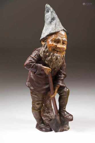 A garden gnome with a shovelPolychrome terracotaAustria, 19th centuryHeight: 82 cm