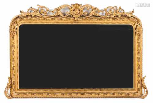 A large mirrorCarved and gilt wood and gessoProfusely decorated in foliage scroll motifsMale bust