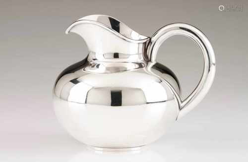 A jugPortuguese silverPlain body and hanlde with scalloped lipOporto hallmark, Eagle (916/000) for