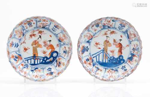 A pair of scalloped platesChinese export porcelainImari decoration with central garden scape and