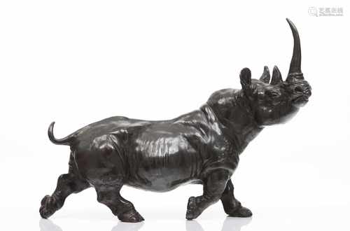 A rhinocerosLost wax sculpturePatinated bronzeSigned J.Pitarch(stand missing)31x44x12 cm