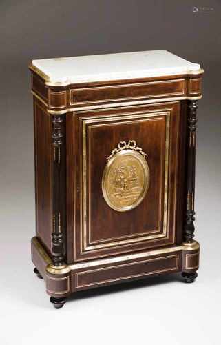 A Napoleon III cupboardMahogany and darkened woodWith yellow metal applied ornamentsLow relief,