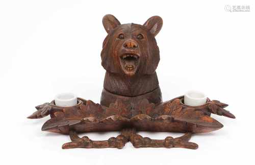 A Black Forest inkwellCarved woodBear's head and foliage decorationTwo wells and watch